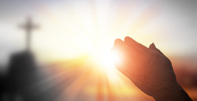 a blink of an eye, heart and soul, light with cross shining through hands